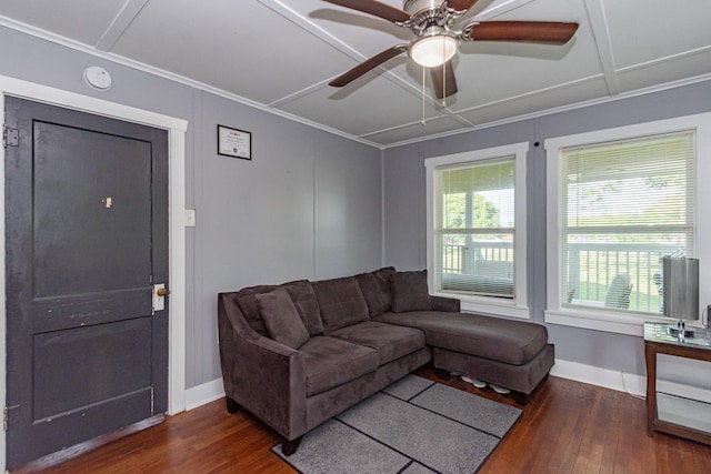 living room with wood finished floors, a ceiling fan, ornamental molding, and baseboards