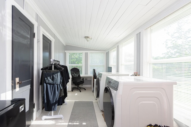 washroom with wood ceiling, laundry area, and washing machine and dryer