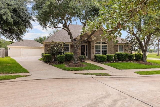 16511 Crystal View Ct, Houston, TX 77095 - view of front facade featuring brick siding, a shingled roof, a front lawn, and driveway