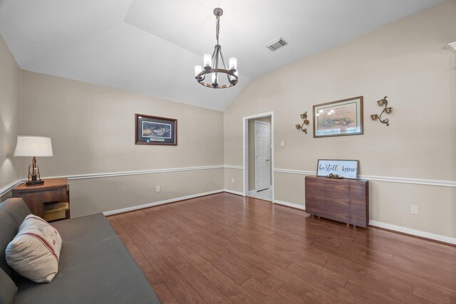 16511 Crystal View Ct, Houston, TX 77095 - living area with an inviting chandelier, baseboards, wood finished floors, lofted ceiling, and visible vents
