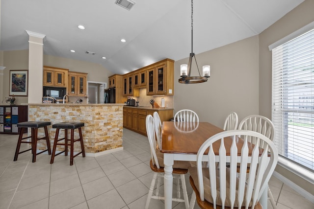 16511 Crystal View Ct, Houston, TX 77095 - dining area with light tile patterned floors, visible vents, a healthy amount of sunlight, and lofted ceiling