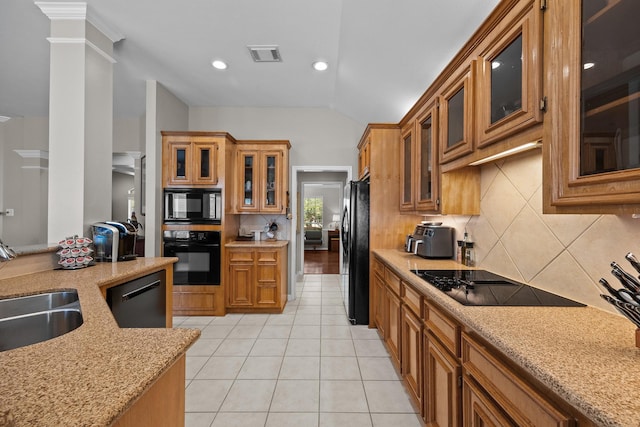 16511 Crystal View Ct, Houston, TX 77095 - kitchen with visible vents, decorative backsplash, a sink, black appliances, and vaulted ceiling