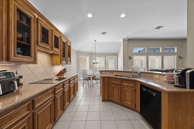 16511 Crystal View Ct, Houston, TX 77095 - kitchen with decorative backsplash, brown cabinets, a sink, light tile patterned floors, and black appliances