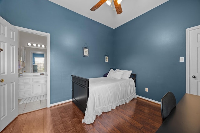 16511 Crystal View Ct, Houston, TX 77095 - bedroom featuring baseboards, a sink, ensuite bathroom, and hardwood / wood-style floors