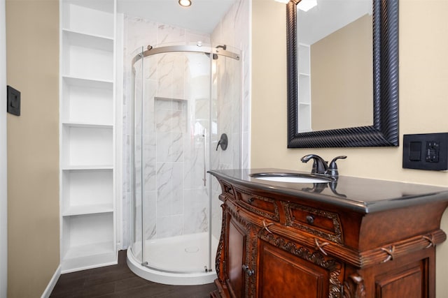 106 Rosewood Dr, Crockett, TX 75835 - full bath with a stall shower, built in features, wood finished floors, and vanity