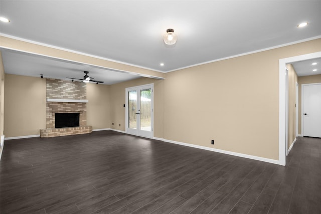 106 Rosewood Dr, Crockett, TX 75835 - unfurnished living room with a fireplace, ceiling fan, dark wood finished floors, and baseboards