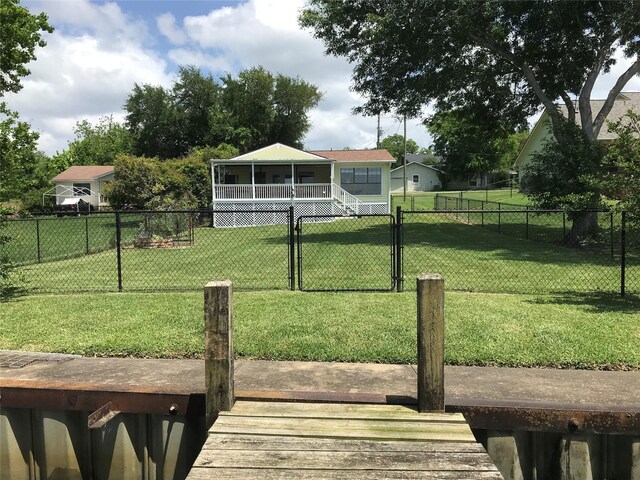 104 Bayside St, Livingston, TX 77351 - exterior space featuring a gate, fence private yard, and a yard
