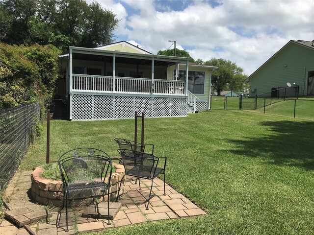 104 Bayside St, Livingston, TX 77351 - rear view of property featuring a yard, a fenced backyard, and a patio area