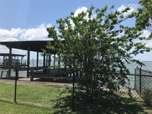 104 Bayside St, Livingston, TX 77351 - view of dock featuring fence and a water view