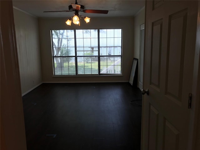 104 Bayside St, Livingston, TX 77351 - empty room with baseboards, dark wood-style floors, ceiling fan, and crown molding