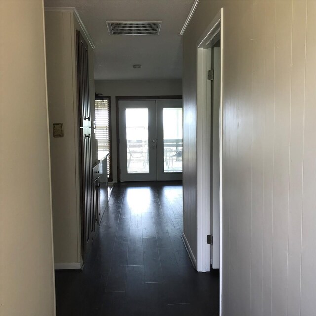 104 Bayside St, Livingston, TX 77351 - corridor with visible vents, dark wood-style flooring, french doors, and baseboards
