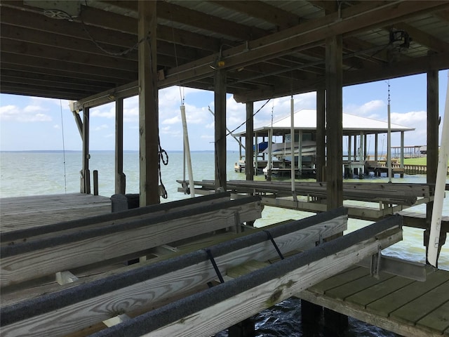 104 Bayside St, Livingston, TX 77351 - view of dock featuring boat lift and a water view