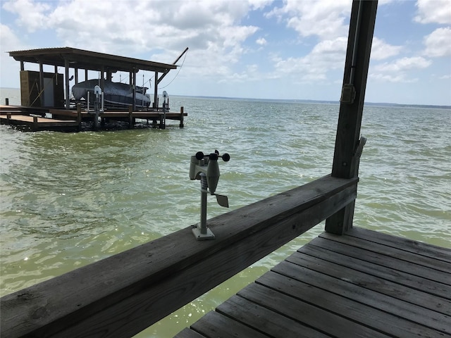 104 Bayside St, Livingston, TX 77351 - view of dock with boat lift and a water view