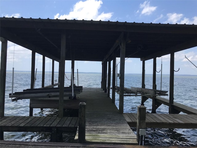 104 Bayside St, Livingston, TX 77351 - dock area featuring a water view and boat lift