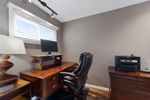 office area featuring baseboards and wood finished floors
