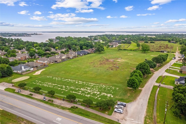 bird's eye view featuring a water view and a residential view