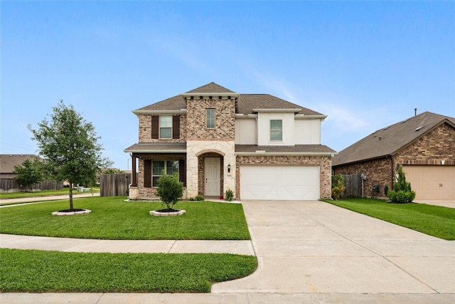view of front of property with fence, concrete driveway, stucco siding, and a front lawn