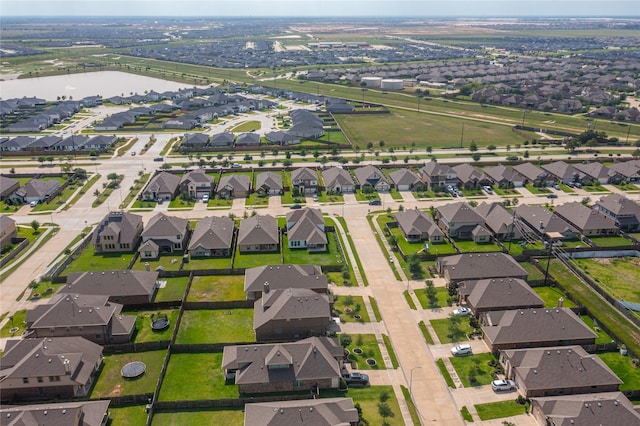 bird's eye view with a residential view and a water view