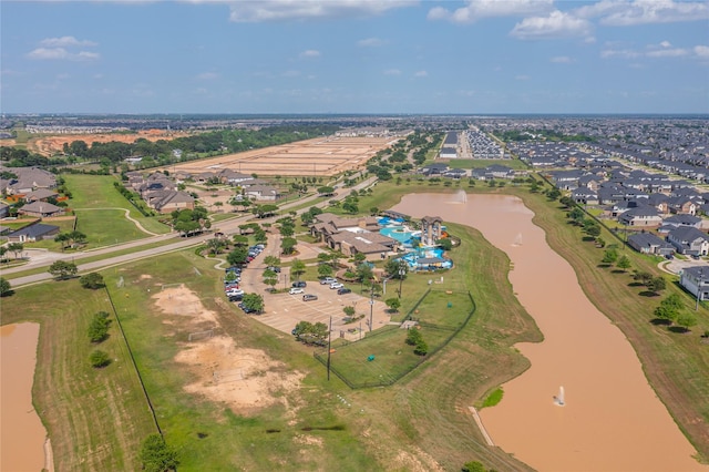 bird's eye view featuring a residential view and a water view