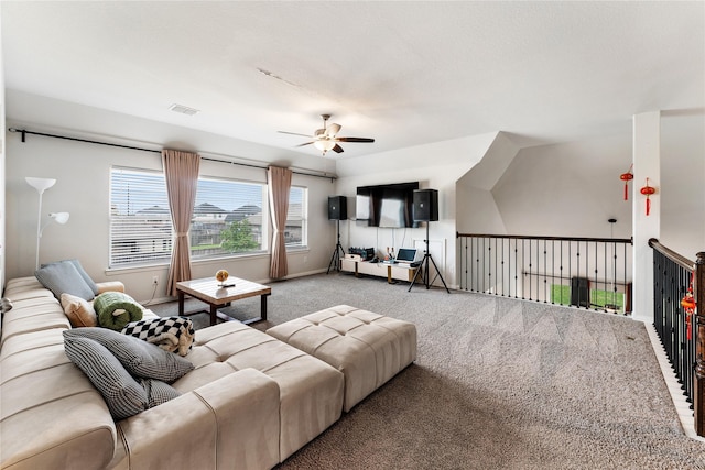 living room featuring carpet, visible vents, a ceiling fan, and baseboards