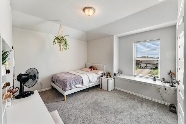 bedroom with carpet flooring and baseboards