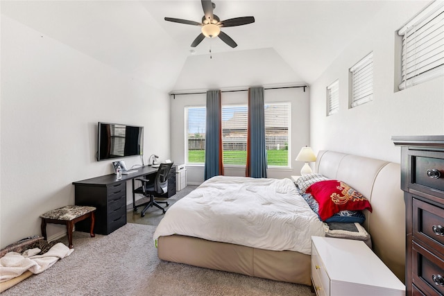 carpeted bedroom with ceiling fan and vaulted ceiling