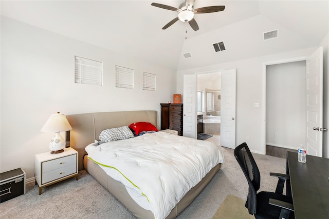 bedroom featuring visible vents, ensuite bathroom, lofted ceiling, and carpet flooring