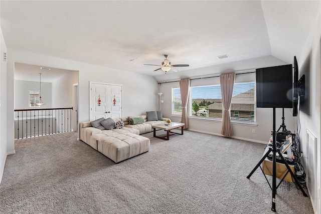 living area with visible vents, ceiling fan, and carpet flooring