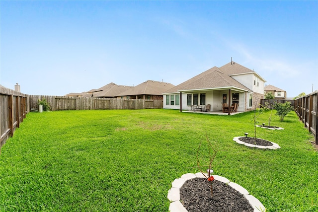 view of yard featuring a patio and a fenced backyard