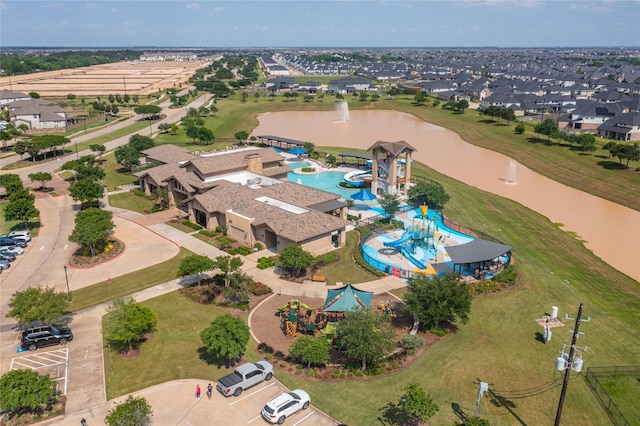 bird's eye view featuring a residential view and a water view