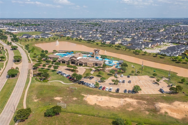 bird's eye view featuring a residential view and a water view