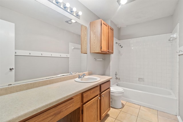 full bathroom featuring toilet, tile patterned flooring, vanity, and  shower combination
