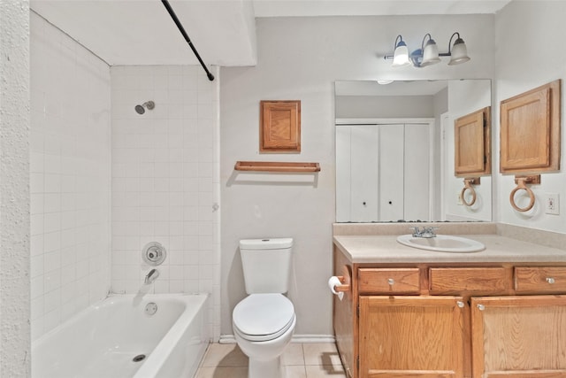 bathroom with washtub / shower combination, toilet, tile patterned flooring, and vanity