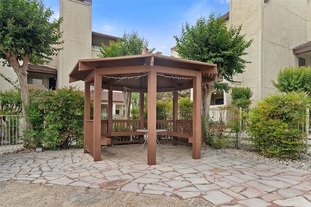 view of patio / terrace with a gazebo and fence