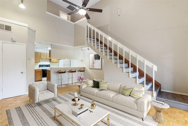 5322 Medical Dr Unit E203, San Antonio, TX 78240 - living area with a high ceiling, stairway, and a ceiling fan