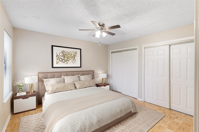 5322 Medical Dr Unit E203, San Antonio, TX 78240 - bedroom featuring multiple closets, multiple windows, a textured ceiling, and a ceiling fan