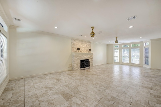 unfurnished living room featuring visible vents, a ceiling fan, a stone fireplace, and crown molding