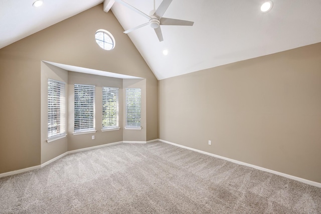 spare room with carpet flooring, baseboards, recessed lighting, a ceiling fan, and high vaulted ceiling