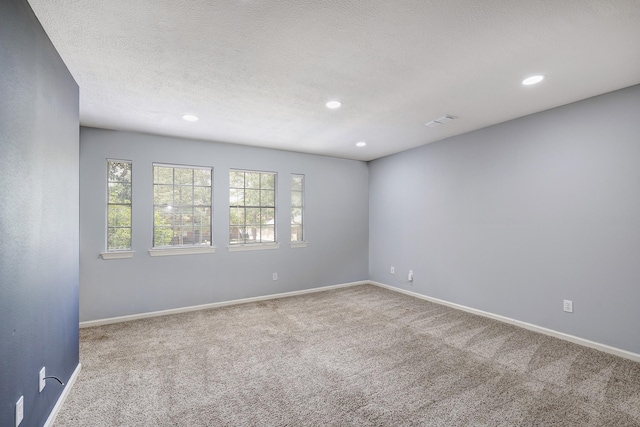 unfurnished room featuring baseboards, recessed lighting, and carpet