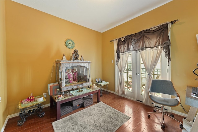 office area with baseboards and wood finished floors