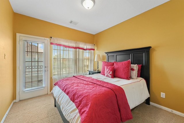 bedroom featuring carpet flooring, access to outside, baseboards, and visible vents
