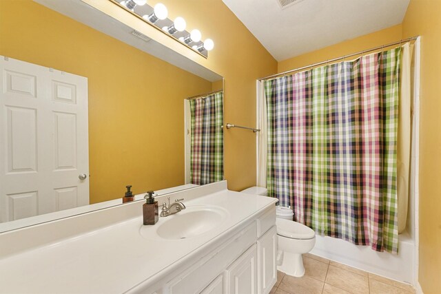 6107 S Arrowana Ln, Houston, TX 77036 - full bath featuring tile patterned floors, toilet, vanity, and shower / bath combination with curtain