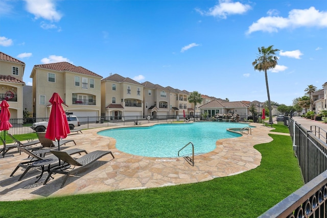 6107 S Arrowana Ln, Houston, TX 77036 - community pool featuring fence, a residential view, and a patio