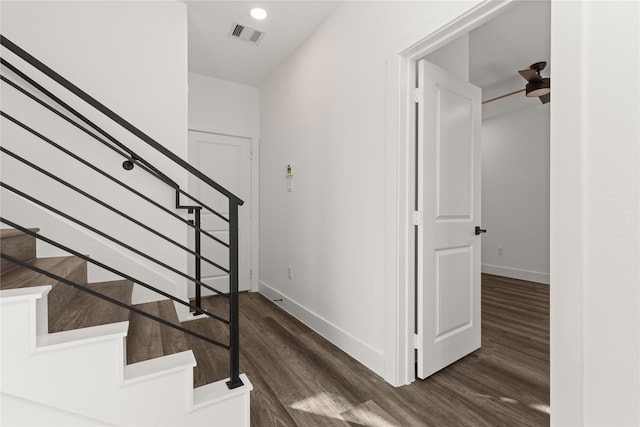 2707 Dennis St, Houston, TX 77004 - stairway featuring wood finished floors, visible vents, and baseboards