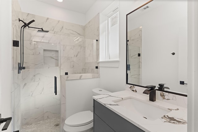 2707 Dennis St, Houston, TX 77004 - bathroom with visible vents, a marble finish shower, toilet, and vanity
