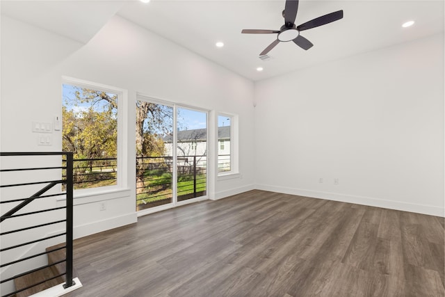 2707 Dennis St, Houston, TX 77004 - empty room with ceiling fan, recessed lighting, dark wood finished floors, and baseboards