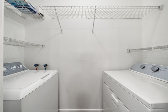 laundry area with washer and clothes dryer and laundry area