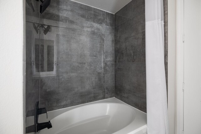 bathroom featuring  shower combination