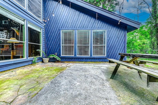 rear view of house with a patio