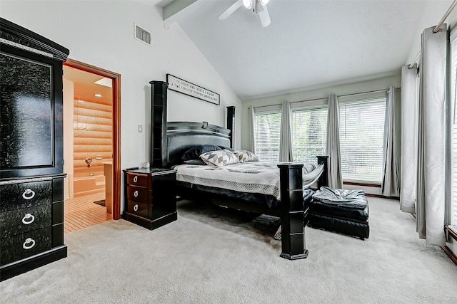 carpeted bedroom featuring visible vents, ceiling fan, vaulted ceiling with beams, and ensuite bathroom